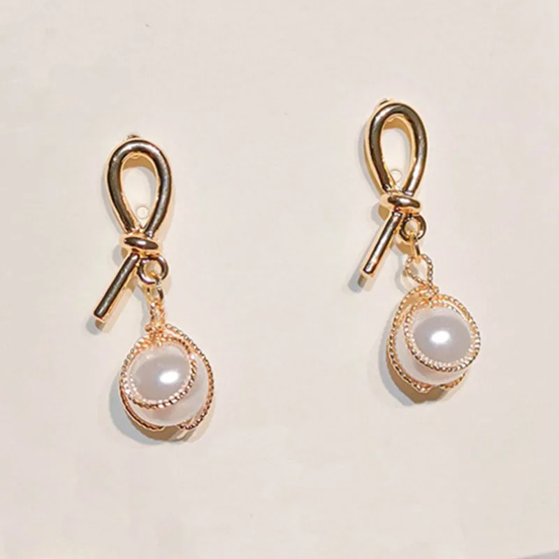 

2021 Sale Rushed Tin Alloy Spike Brincos Oorbellen Needle South Net Tie Fashionable And Versatile Pearl Earrings Women Brinco