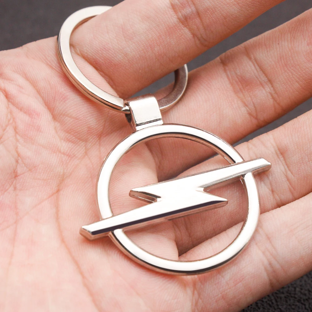 

1PCS Hot Fashion Peace World Pendant Key Ring Metal Chain Silver Color Car Gift Souvenirs Keychain FOR Opel Astra H J Insignia C
