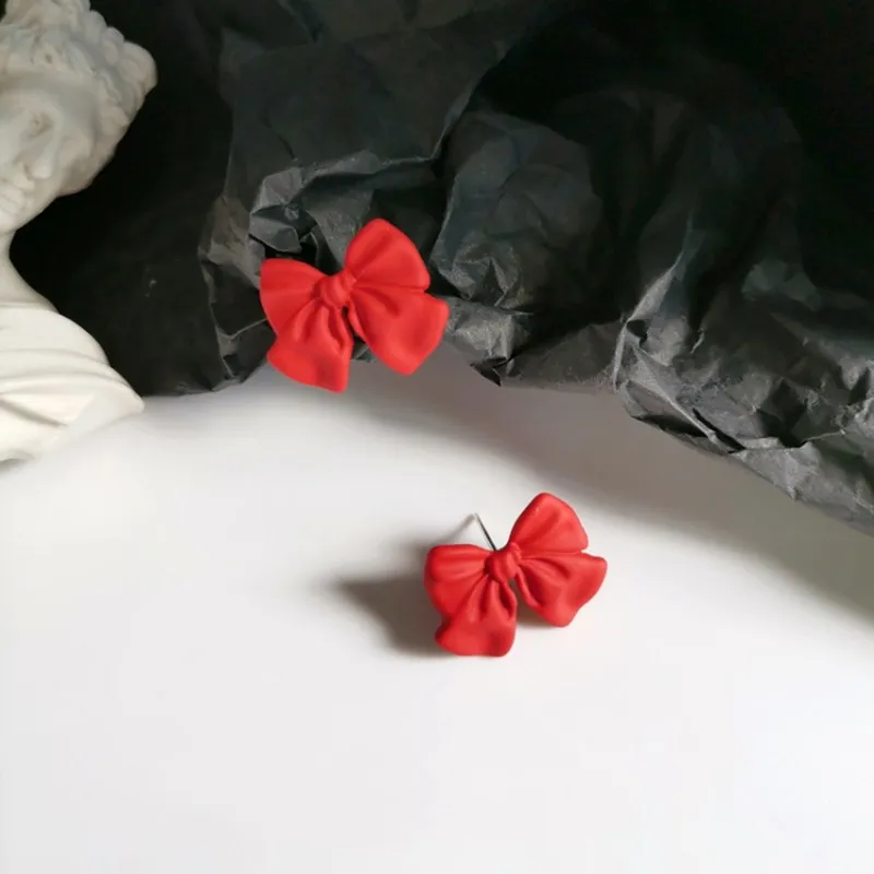 

Korean bow earrings sweet girl heart earrings female temperament red short clip
