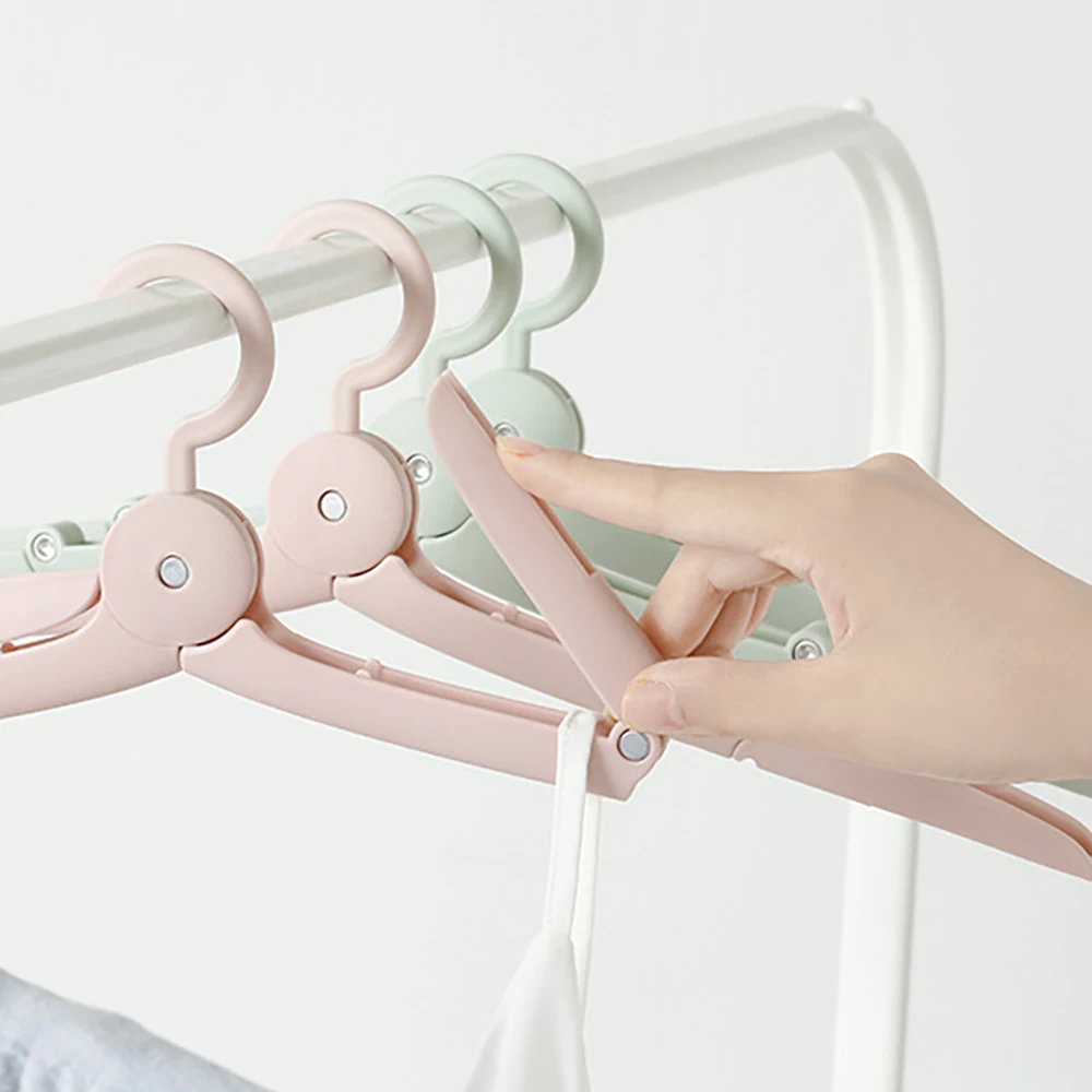 Многофункциональная телескопическая складная вешалка Волшебная для