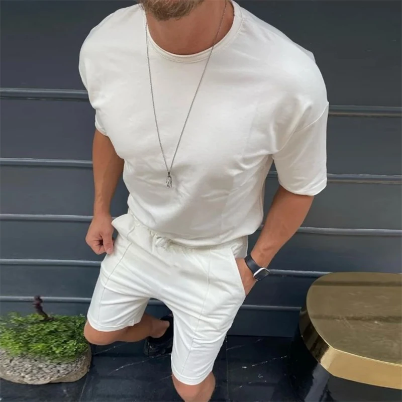 

Костюм спортивный мужской из двух предметов, пуловер с коротким рукавом и шорты в хипстерском стиле, повседневный однотонный костюм, улична...