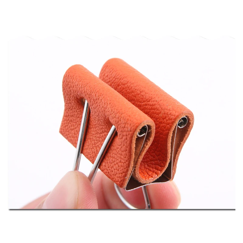 

Stainless steel clip with leather leather boding aids helper with sheep leather on surface to protect the craft