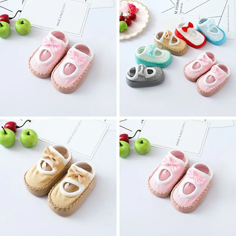Теплые нескользящие носки тапочки для малышей осенние хлопковые с бантом