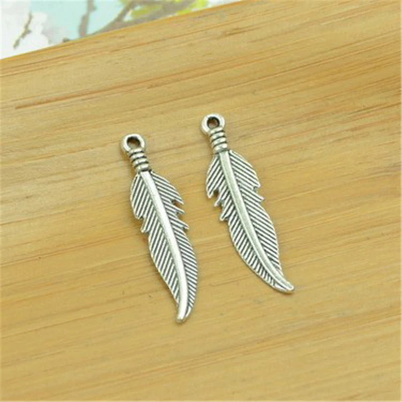 

Oein 30pcs/lot 7x27mm Antique Metal Color Metal Dream Catcher Feather Charms for Jewelry Making Bulk Necklace Bracelet Making