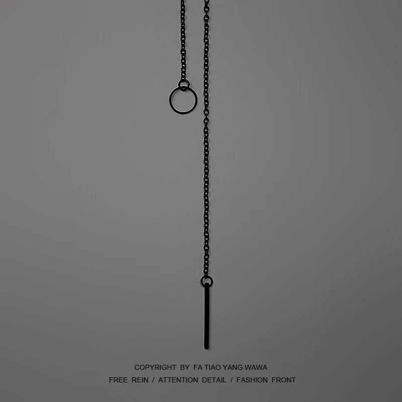 

A simple black necklace with a one-word ring
