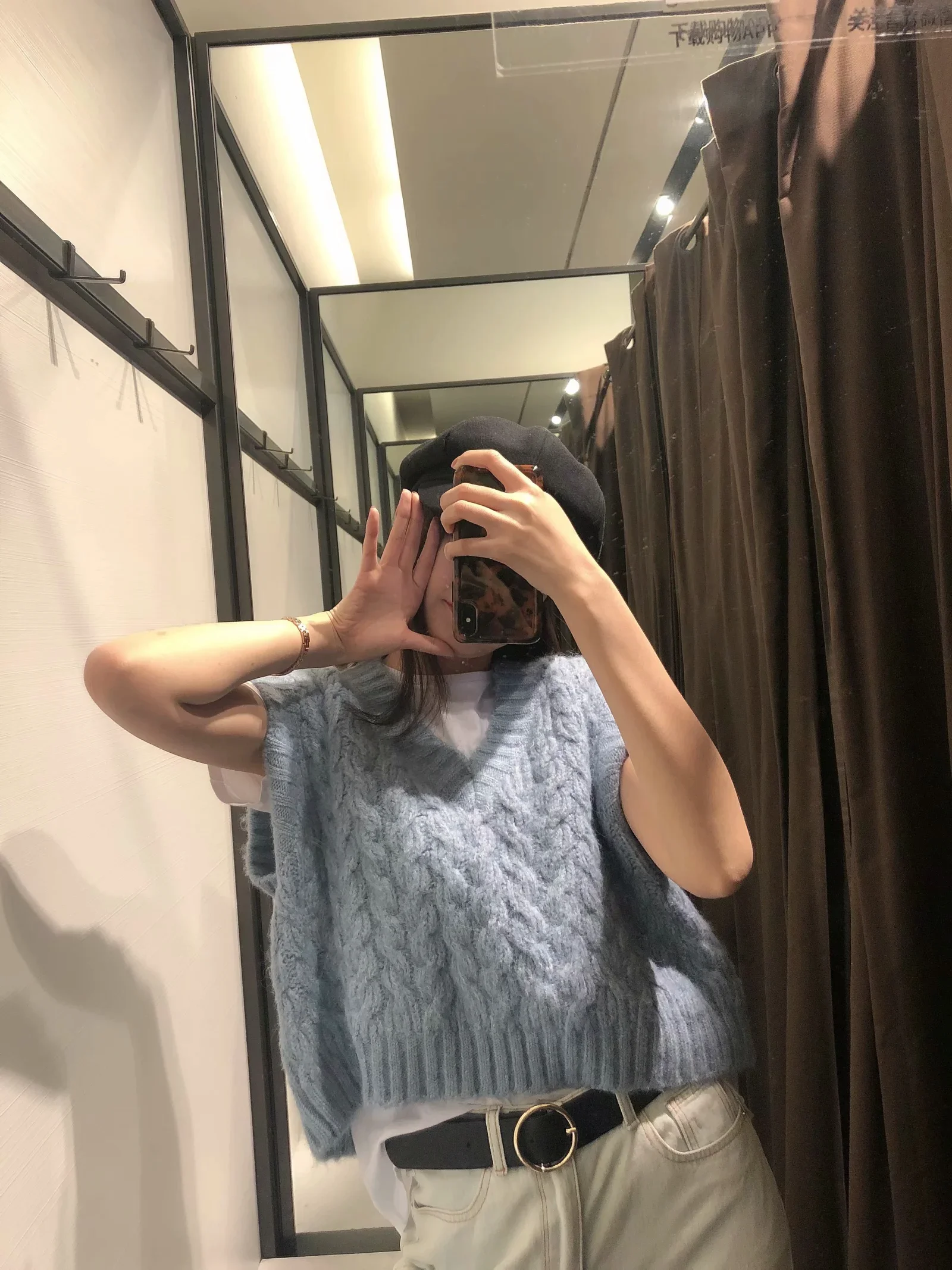 

An eight-strand knitted sweater vest
