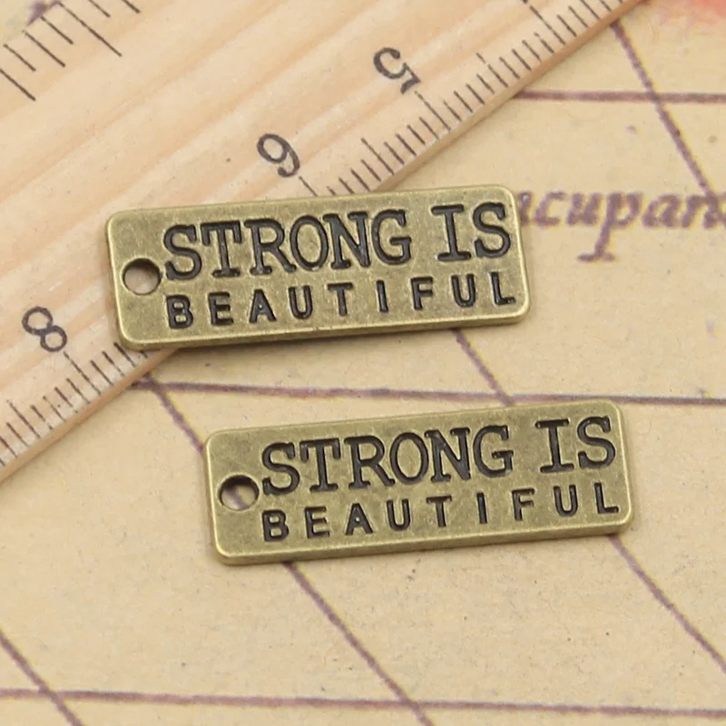 

15pcs Charms Strong Is Beautiful 10x27mm Tibetan Bronze Silver Color Pendants Antique Jewelry Making DIY Handmade Craft Bracelet