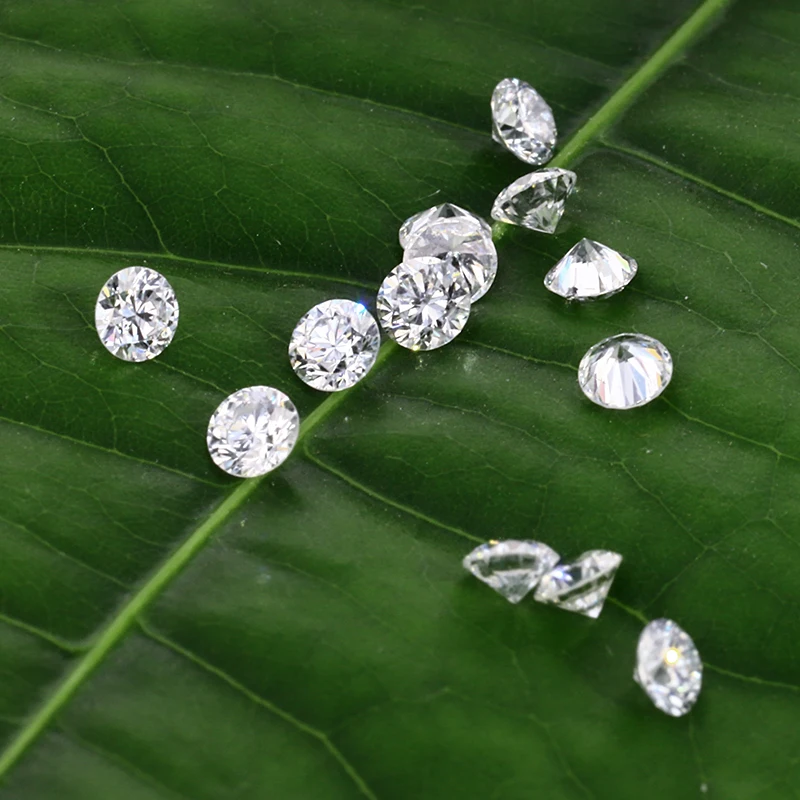 

0.54 carat G Color VS Clarity Round brilliant cut Loose Lab Grown HPHT Diamond and diamond tester