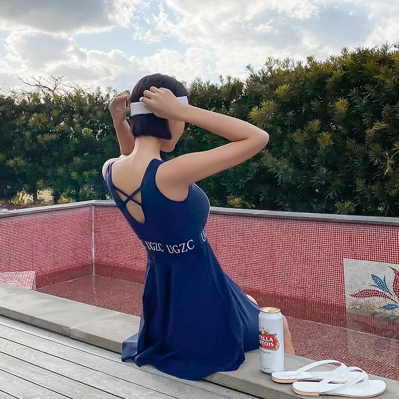 Женский купальник из двух предметов темно синий с плиссированным подолом и