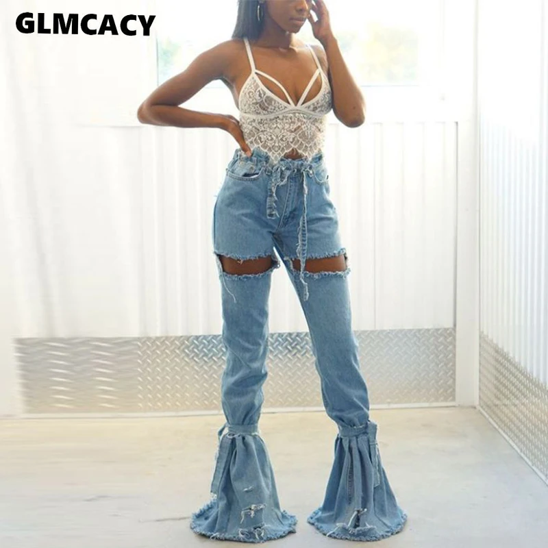 Женские расклешенные джинсы с высокой талией черные рваные расклешенным низом