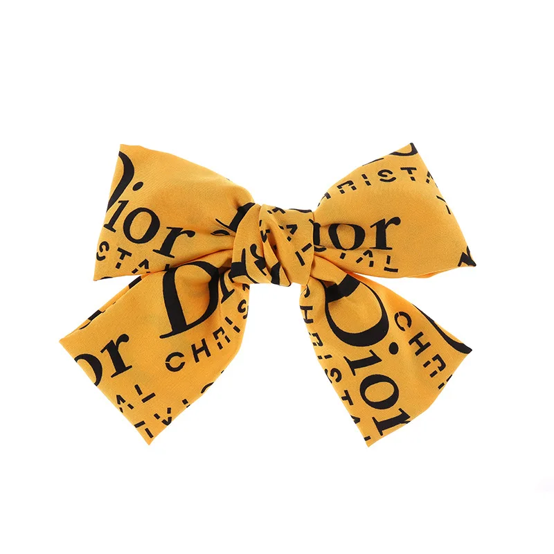 

European and American big letter D bow hairpin wild lady spring clip net red back head clip hair accessory