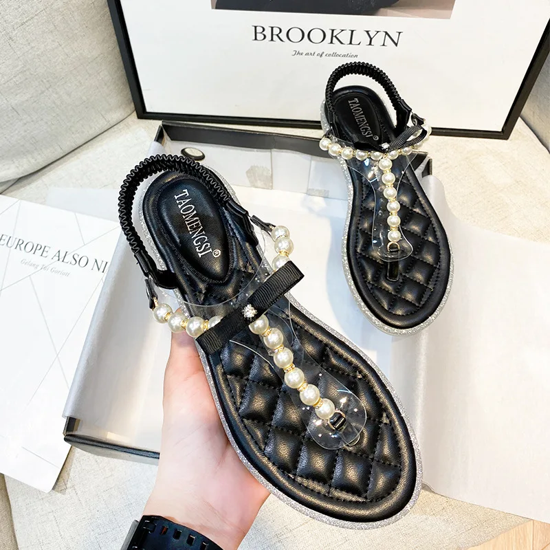 

In Summer 2021 The New Online Celebrity Fairy Wind Pearl Flat Beach Sandals and Slippers Are Worn By Women Wearing Sandals