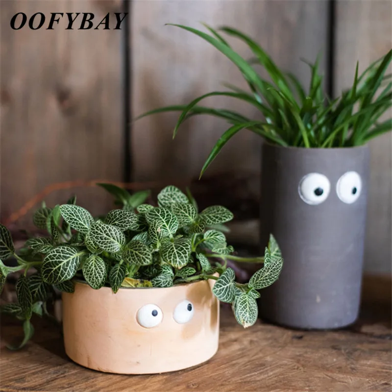 Милый маленький цветочный горшок цемент с большими глазами для офиса планшетов