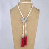 42 white pearl bowknot tassel necklace cz pendant