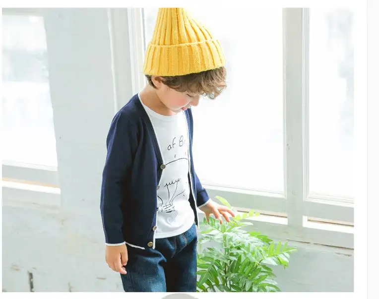 

The boy knitted a cardigan