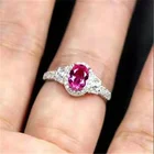 Женское кольцо в форме яйца, серебристого цвета, с красным овальным кристаллом