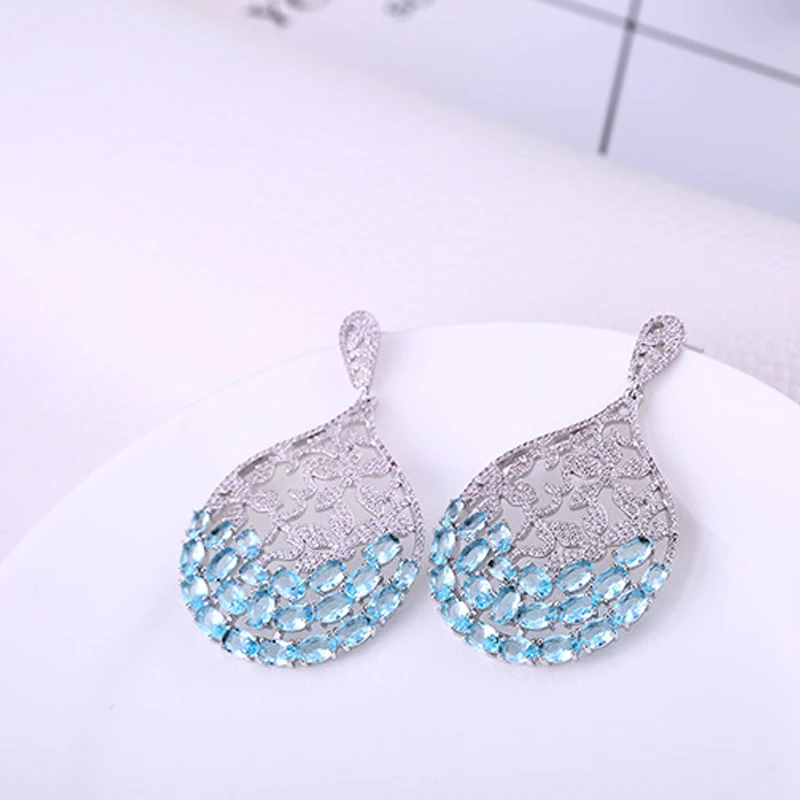 

European and American big-name earrings women's micro-inlaid hollow flower earrings women creative personality banquet earrings