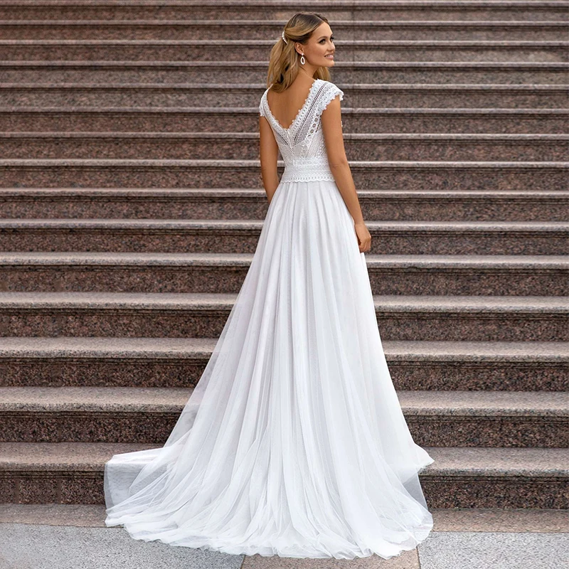 

2021 New Boho Beach Cap Sleeves Bridal Wedding Dresses Lace V Neckline Back Out Wedding Gowns for Bride Sweep Train On Sale