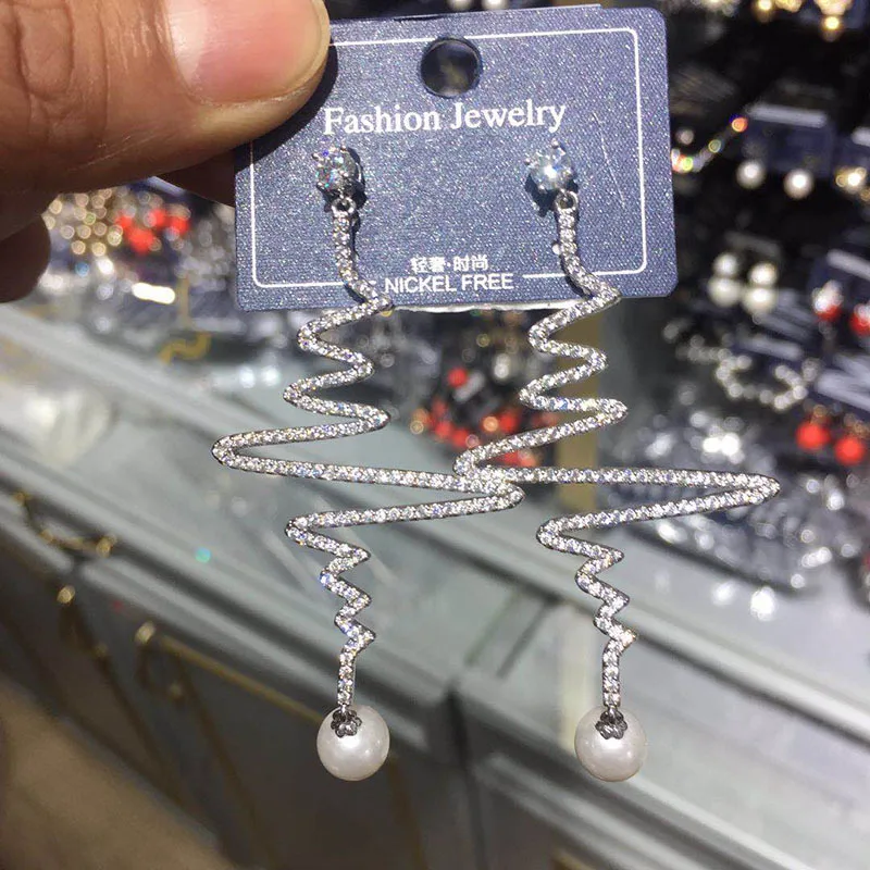 

S925 silver needle micro inlaid zircon lightning wave earrings personalized long tassels creative fashion earrings