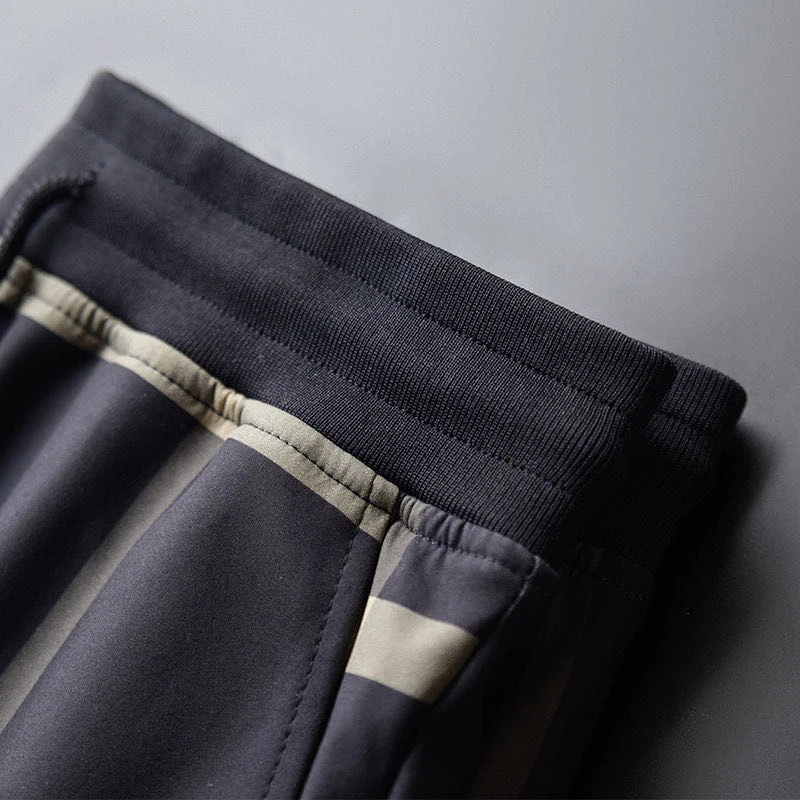 

Sports casual plaid pants men's autumn new loose trousers men's striped pants tie-foot sports European and American models