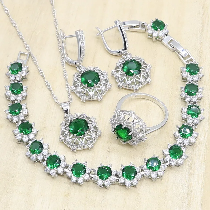 Женский ювелирный комплект из колье серёг и браслета серебристого