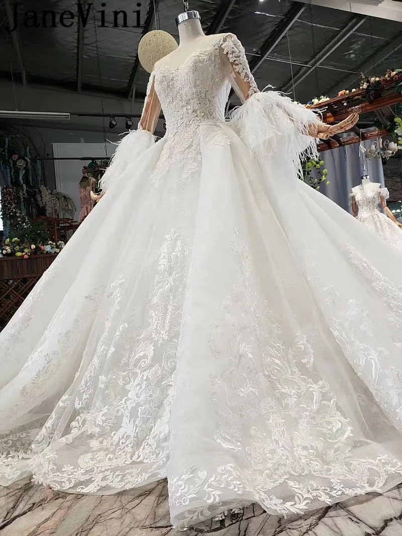 JaneVini Dubai Beaded Wedding Dress Feathers Long Sleeves Lace Pearls Ball Gown Bridal Dresses Luxury African Wedding Gowns 2020