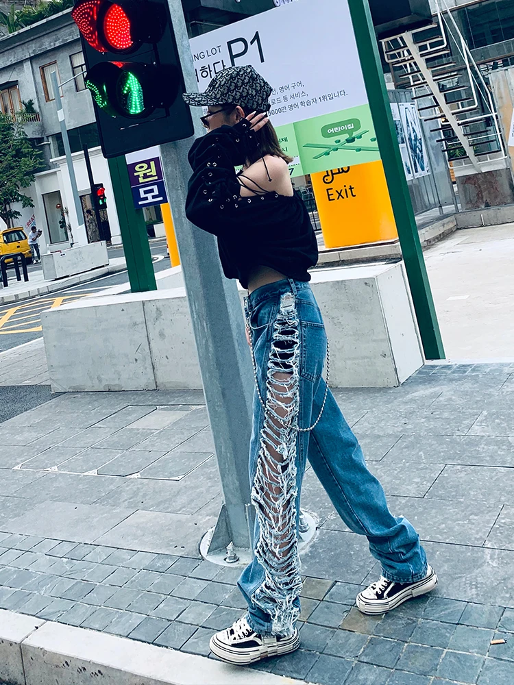 Модные брендовые женские джинсы с боковыми дырками на весну 2020 свободные