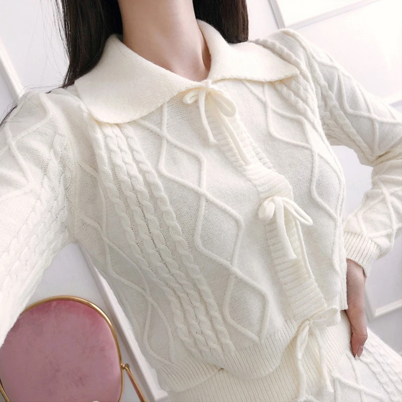 

new arrival fashion winter knitting bouncy set women OL fresh sweet white bow sweater and mini skirt twist slim two piece set
