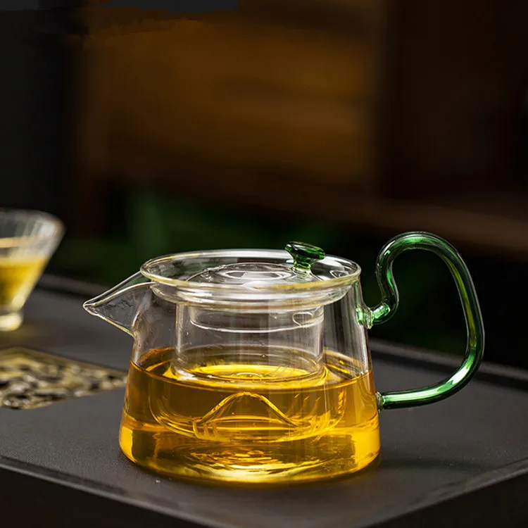 

Color handle teapot customized high borosilicate glass flower and grass teapot can be heated for domestic tea brewing teapot