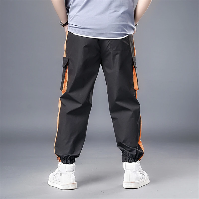 Оранжевые штаны с боковыми полосками пэчворк уличная одежда брюки-карго мужские