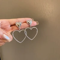 zaystars simple design silver color hollow heart drop earrings for women new brand fashion ear cuff piercing dangle earring gift