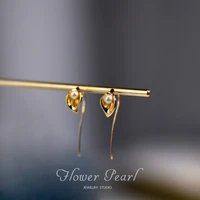 in 2021 the new calla lily pearl earring hook port wind french temperament net red earring female retro personality senior sense