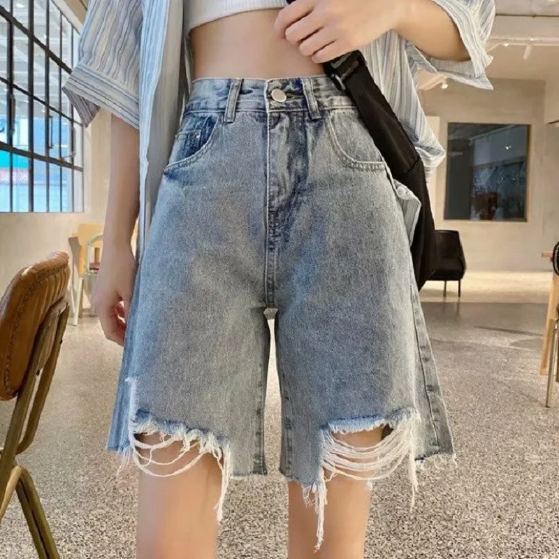 

Personality ripped edge hole denim shorts female summer loose Korean student high waist thin Denim Capris