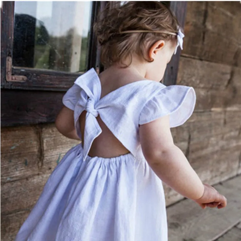 

2021 Spring Baby Girl Dress Ruffle Fly Sleeve Backless Bow Solid A-line Mini Dresses Princess Sweet Toddler Clothes 2-6Y
