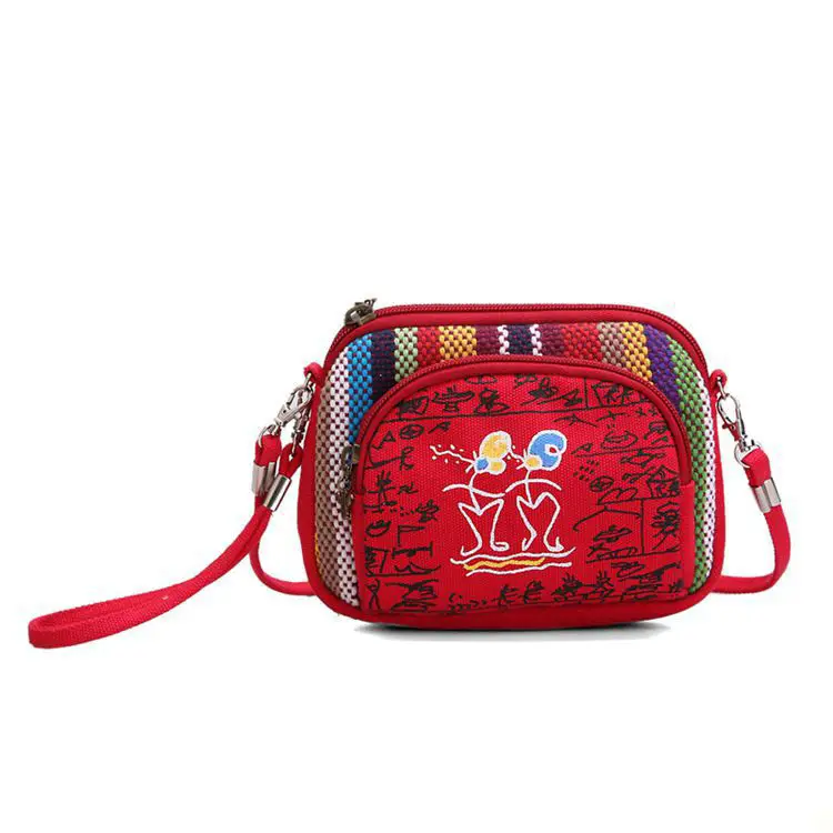 

Yunnan characteristic canvas hand bag lovely female zero wallet 5.5 -inch phone package inclined shoulder bag