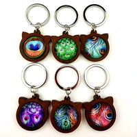 jiangzimei 24pcs new style peacock feather 25mm glass cabochon with cat ears wood cabochon keychain for party gift