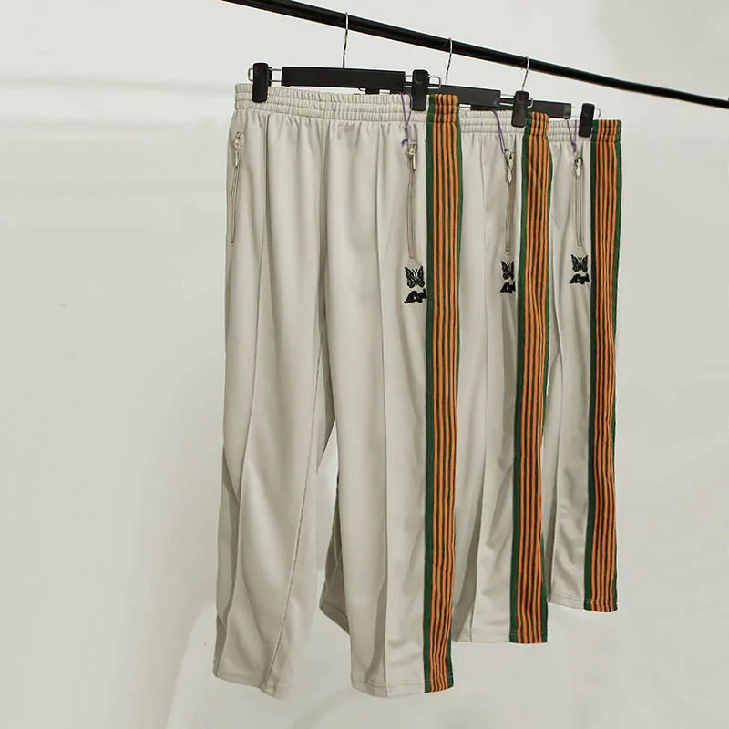 

2021 Autumn Fashion Colorful Stripe Side Webbing Needles Sweatpants Butterfly Embroidery Pants Joggers Needles Trousers Men