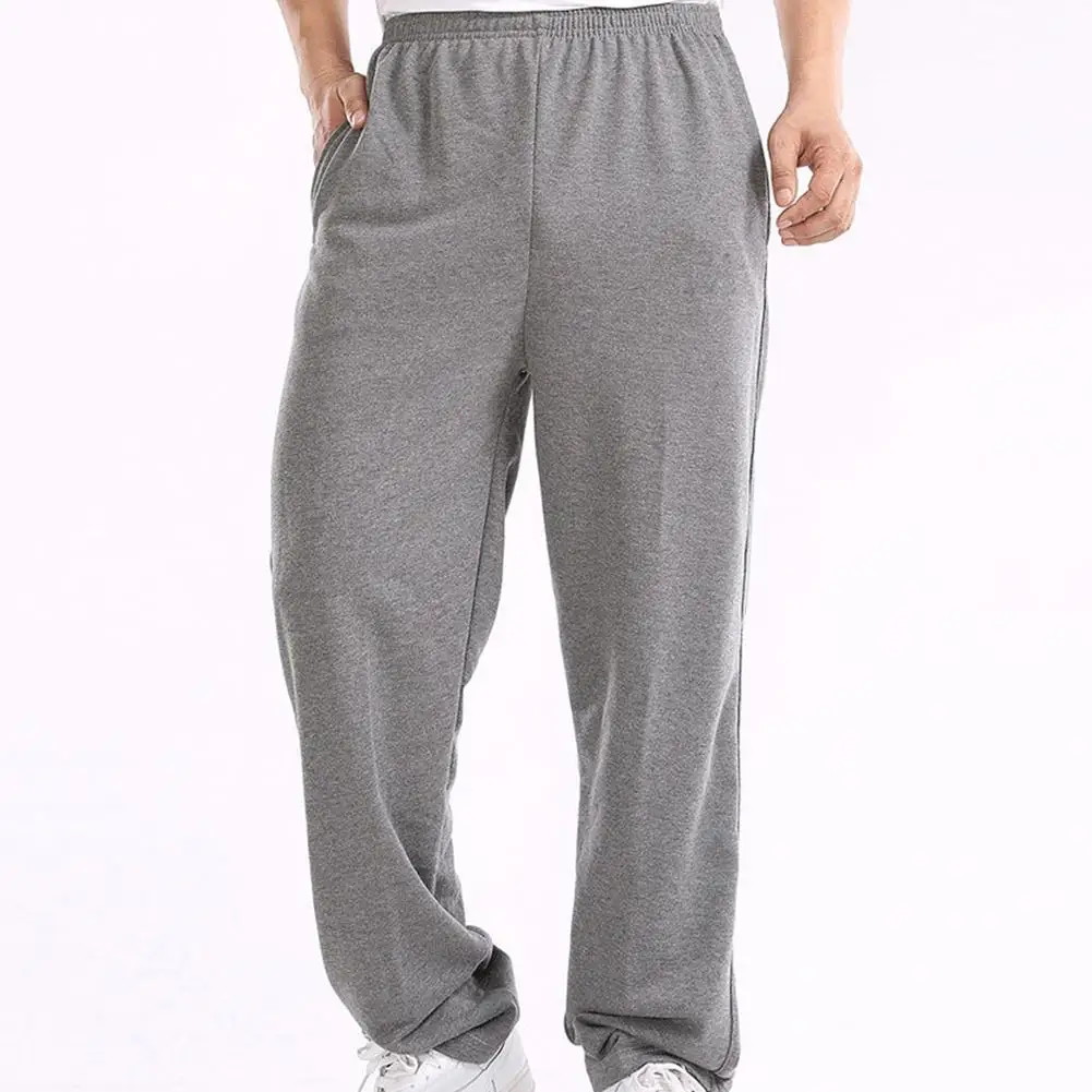 

Men Solid Color Elastic Waistband Pockets Sports Hip Hop Loose Straight Pants