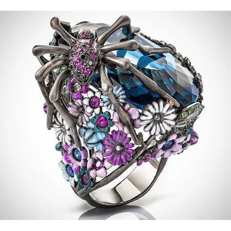 Женское кольцо с эмалью черное в стиле панк крупными камнями и синими