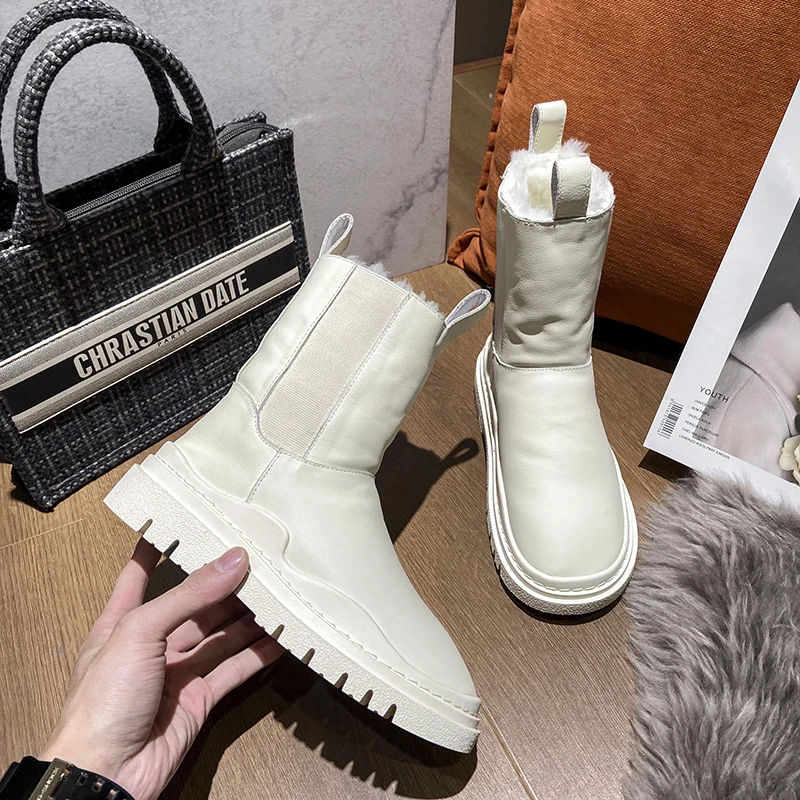 Женские кожаные зимние сапоги на платформе