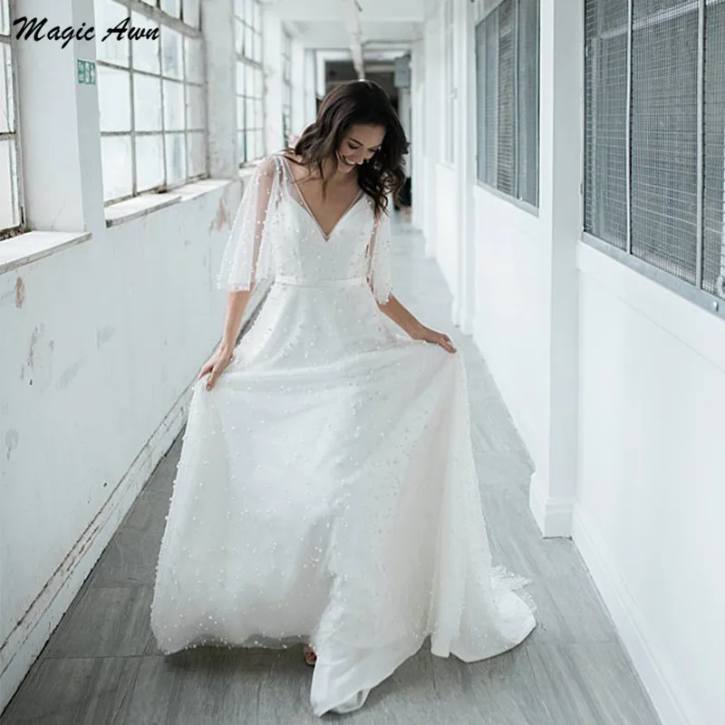 

Magic Awn Beach Wedding Dresses 2021 V-Neck Pearls Beaded Illusion Boho A-Line Country Mariage Gowns Open Back Robe De Mariee