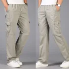 Свободные женские брюки-карго, повседневные мужские комбинезоны с эластичным поясом и несколькими карманами, хлопковые брюки, мужские Длинные Мешковатые брюки большого размера 6XL