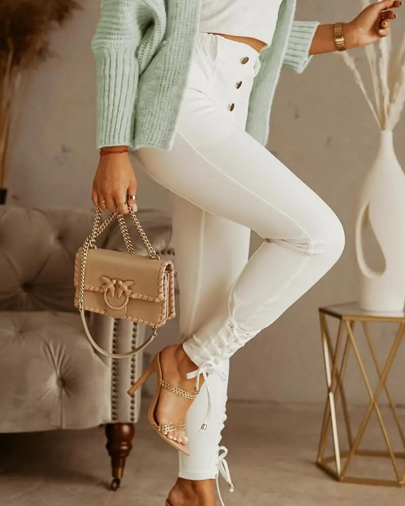 

2021 new fashion female slim fit ladies trousers elegant temperament Button Fly Lace-up Hem Skinny Jeans
