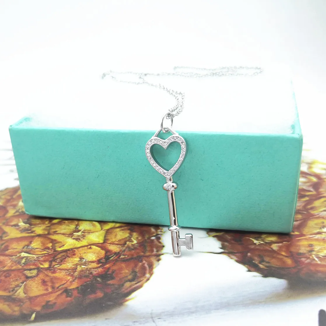 

Г-жа 100% чистого серебра декор циркон Классический сердце-образный ключ кулон ожерелье пар стильные милых романтичных