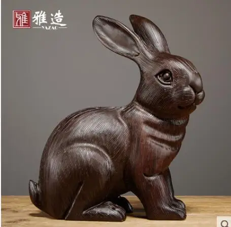 

Black sandalwood carved rabbit furnishing solid wood Zodiac rabbit home carving safety Best wishes Decorative Ornaments