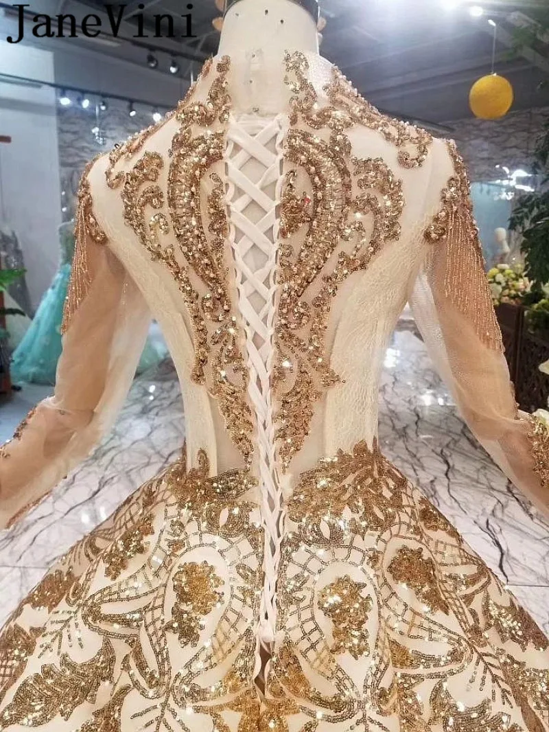 

JaneVini Luxury Arabic Wedding Dresses Gown Dubai Gold Sequins Long Sleeve Beaded Sheer V Neck Plus Size Bridal Dress Ball Gown