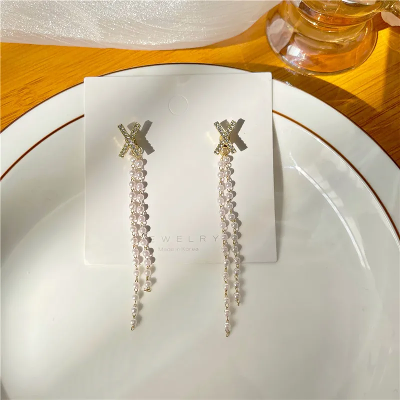 

Personality contracted metal tassel earrings female temperament elegant long new pearl geometry stud earrings