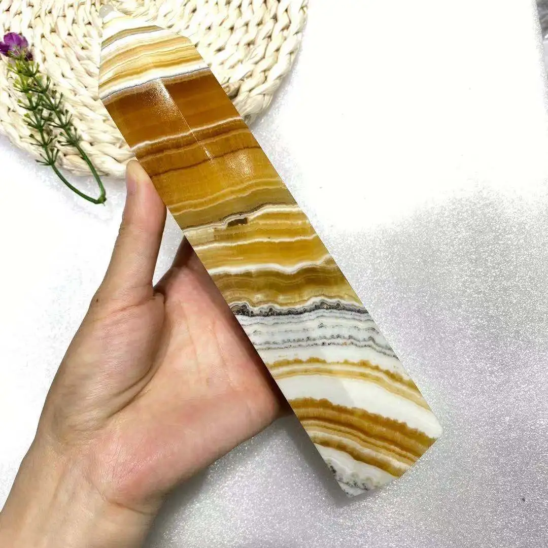 

Rare and beautiful natural thousand-layer calcite crystal obelisk Reiki healing energy scepter room decoration home