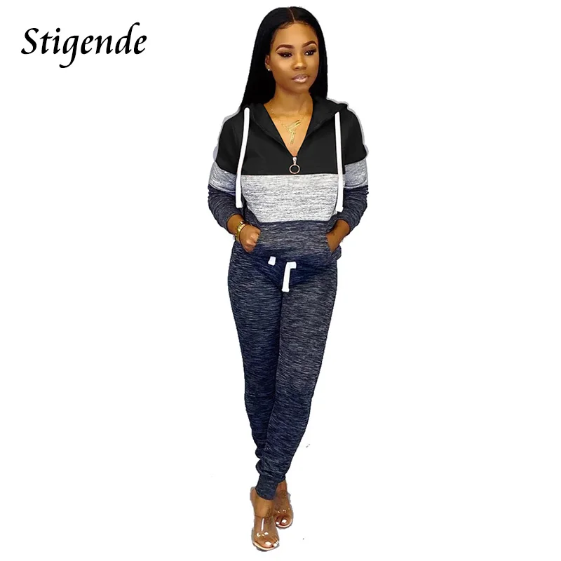 

Костюм спортивный женский составного кроя, с длинным рукавом и карманами