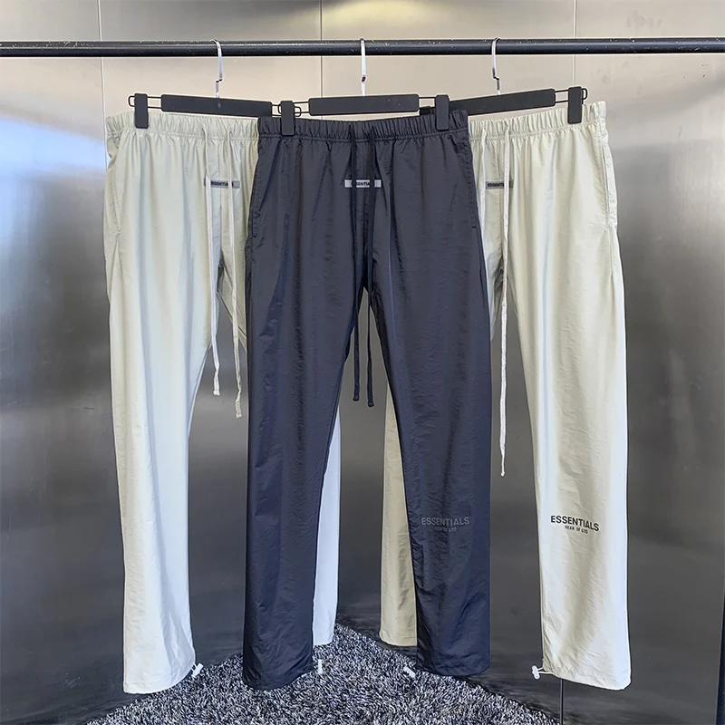 

2021 summer new men's casual pants high quality designer brand high street hip hop loose nylon logo reflective sports pants